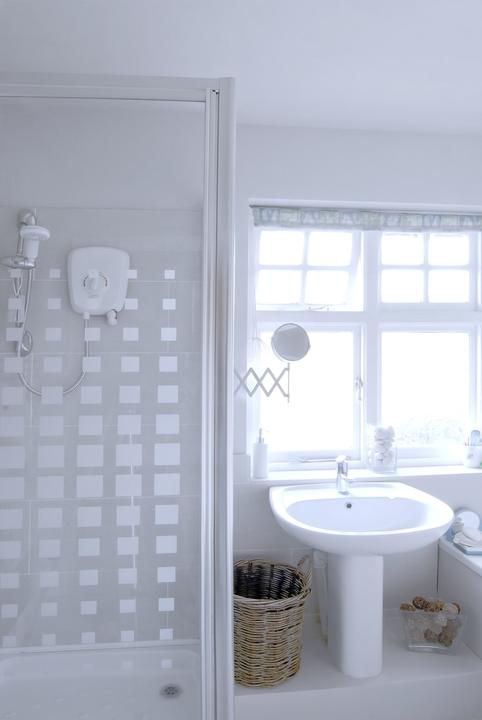 White bathroom with pedestal sink