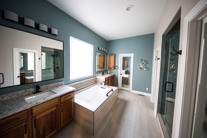 Bathroom with wood vanity and glass shower